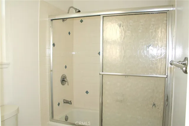 a view of a house with backyard porch and sitting area