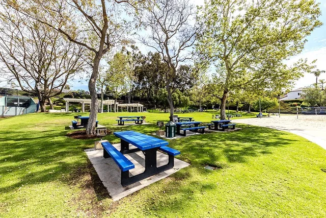a view of a swimming pool and an outdoor seating