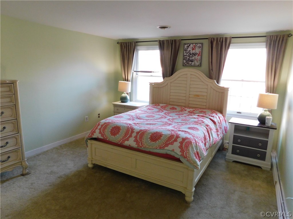 4410 Dunraven Road Chesterfield, VA 23236 - Photo 21 of 41 a bedroom with a bed and window