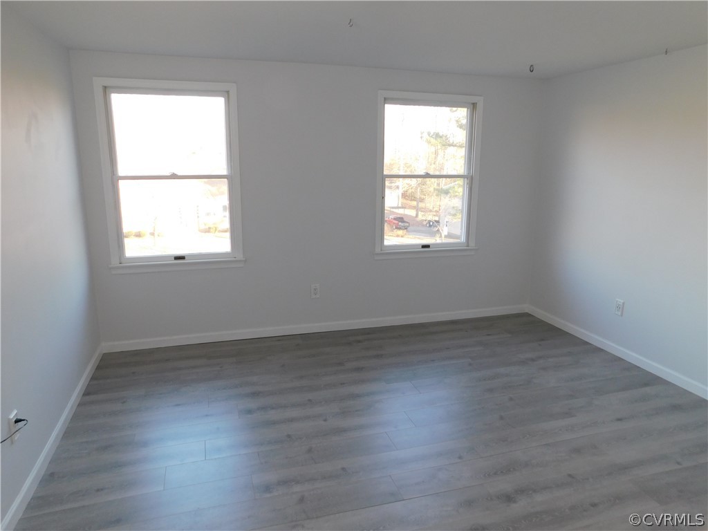 4410 Dunraven Road Chesterfield, VA 23236 - Photo 23 of 41 an empty room with wooden floor and windows