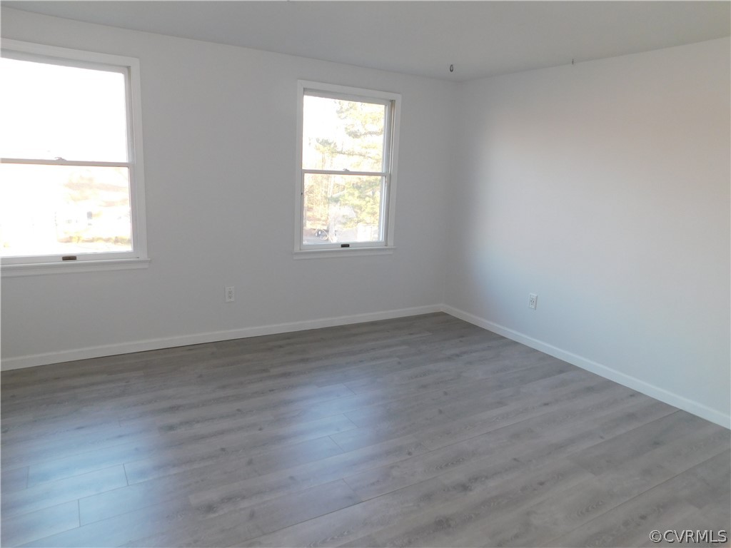 4410 Dunraven Road Chesterfield, VA 23236 - Photo 24 of 41 an empty room with wooden floor and windows