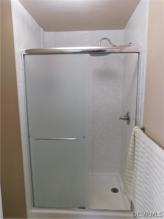 4410 Dunraven Road Chesterfield, VA 23236 - Photo 30 of 41 a bathroom with a glass shower door