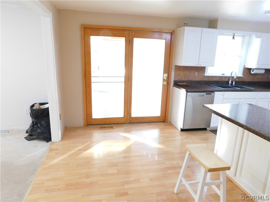 4410 Dunraven Road Chesterfield, VA 23236 - Photo 8 of 41 a kitchen with granite countertop a sink cabinets and a window