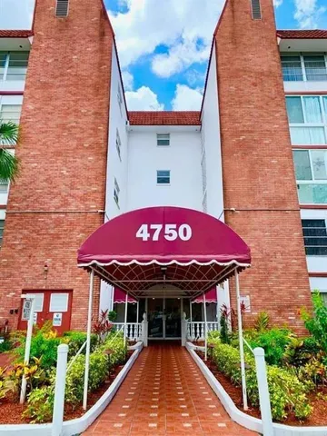 a view of a brick building with a large windows