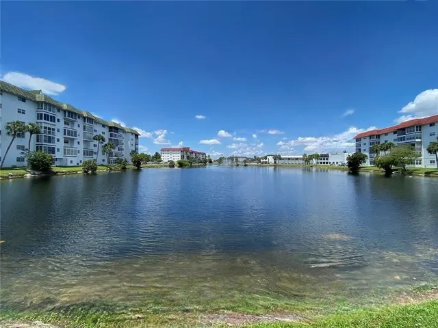 an aerial view of a house with a lake view