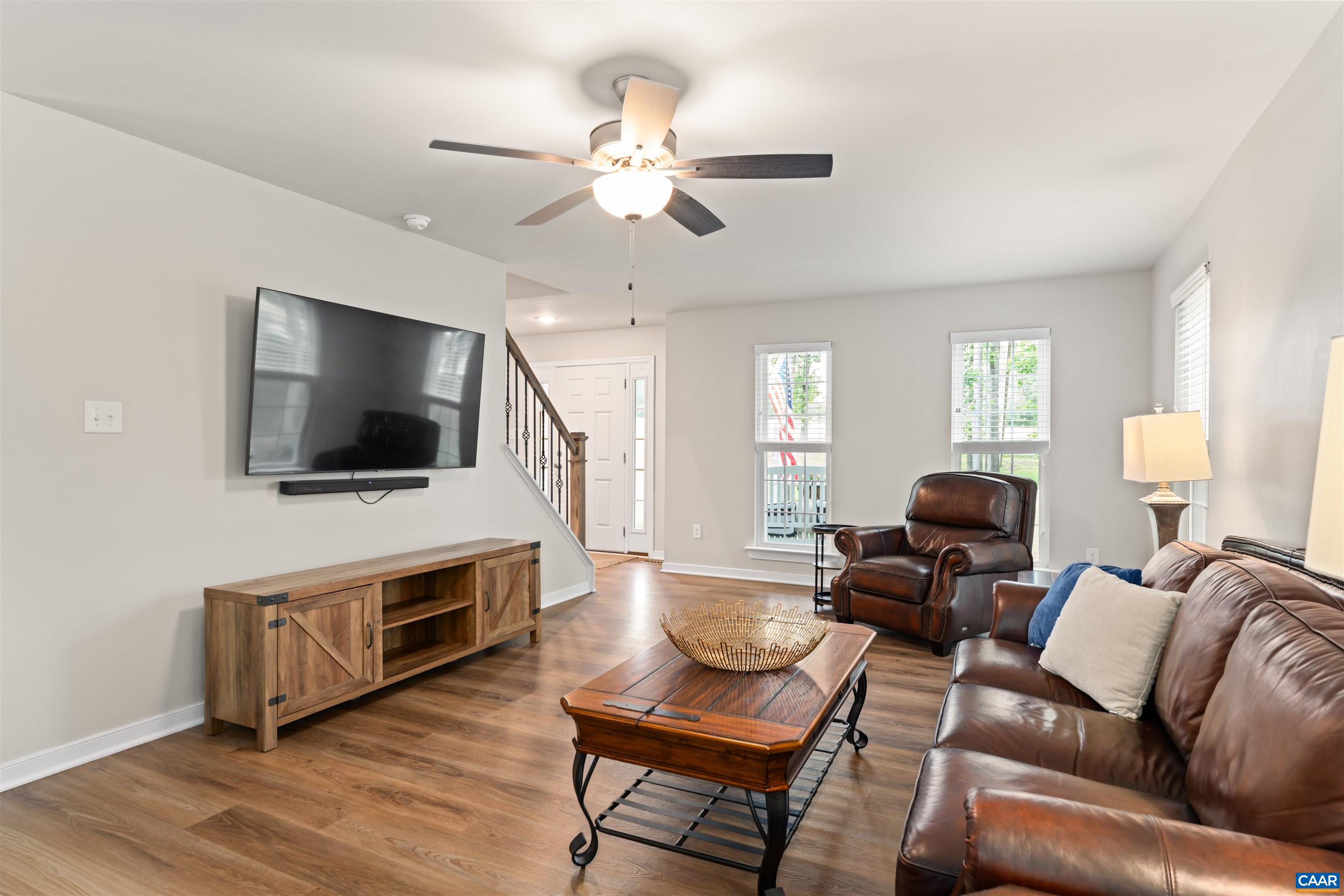 1760 Haden Martin Road Palmyra, VA 22963 - Photo 18 of 51 a living room with furniture a flat screen tv and kitchen view