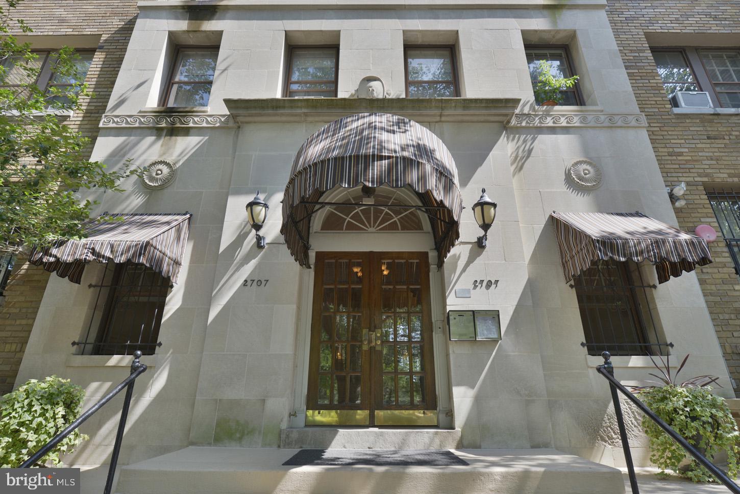 2707 Adams Mill Road Northwest, Unit 400 Washington, DC 20009 - Photo 2 of 21 Elegant entrance with classic awnings.