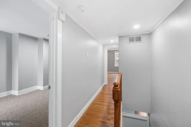 a view of staircase with white walls