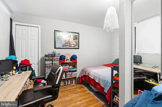 a bedroom with bed and a window