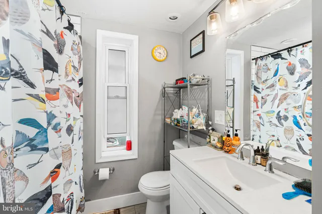 a bathroom with a sink toilet and a bathtub