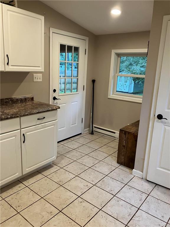 50 Village Road Slippery Rock, PA 16057 - Photo 13 of 26 a kitchen with granite countertop a white cabinets and a stove top oven