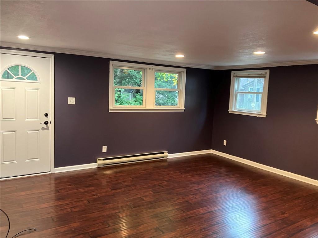50 Village Road Slippery Rock, PA 16057 - Photo 2 of 26 an empty room with wooden floor and windows