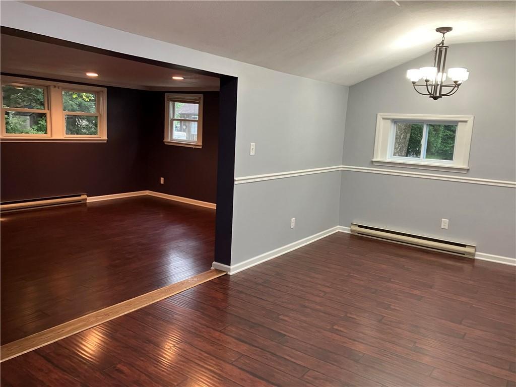 50 Village Road Slippery Rock, PA 16057 - Photo 3 of 26 an empty room with wooden floor and windows