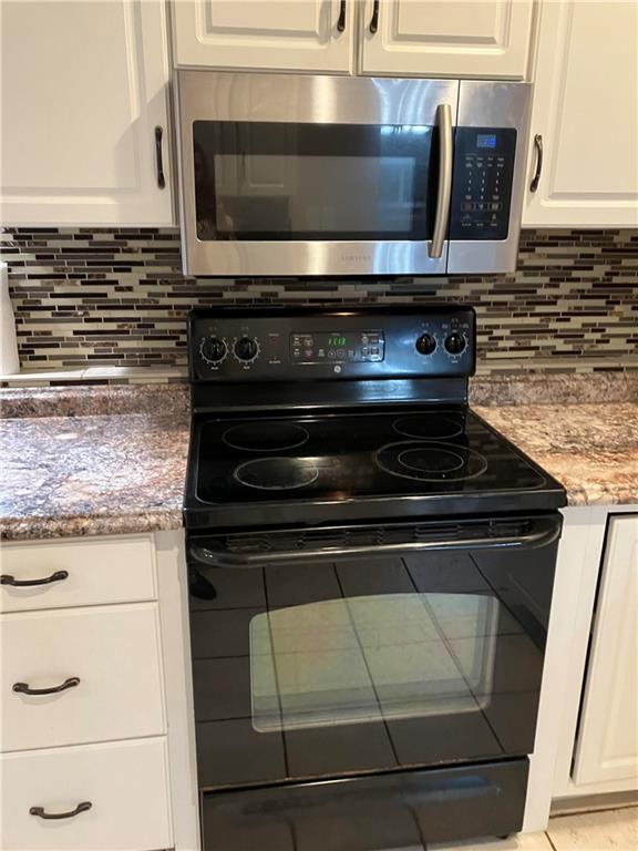 50 Village Road Slippery Rock, PA 16057 - Photo 10 of 26 a stove top oven sitting inside of a kitchen