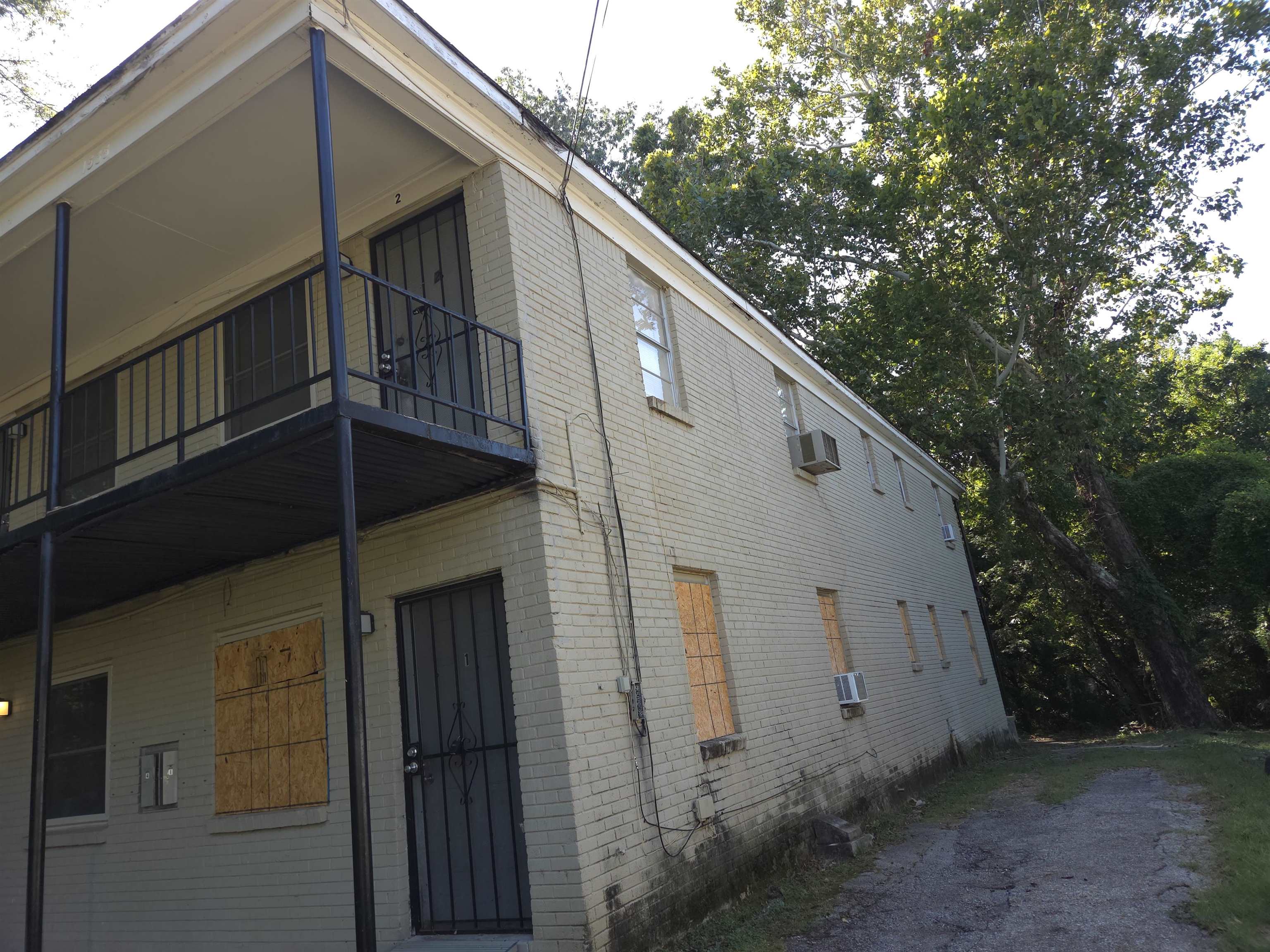 1535 Gaither Street, Unit 14 Memphis, TN 38106 - Photo 3 of 4 View of property exterior featuring brick siding and a balcony