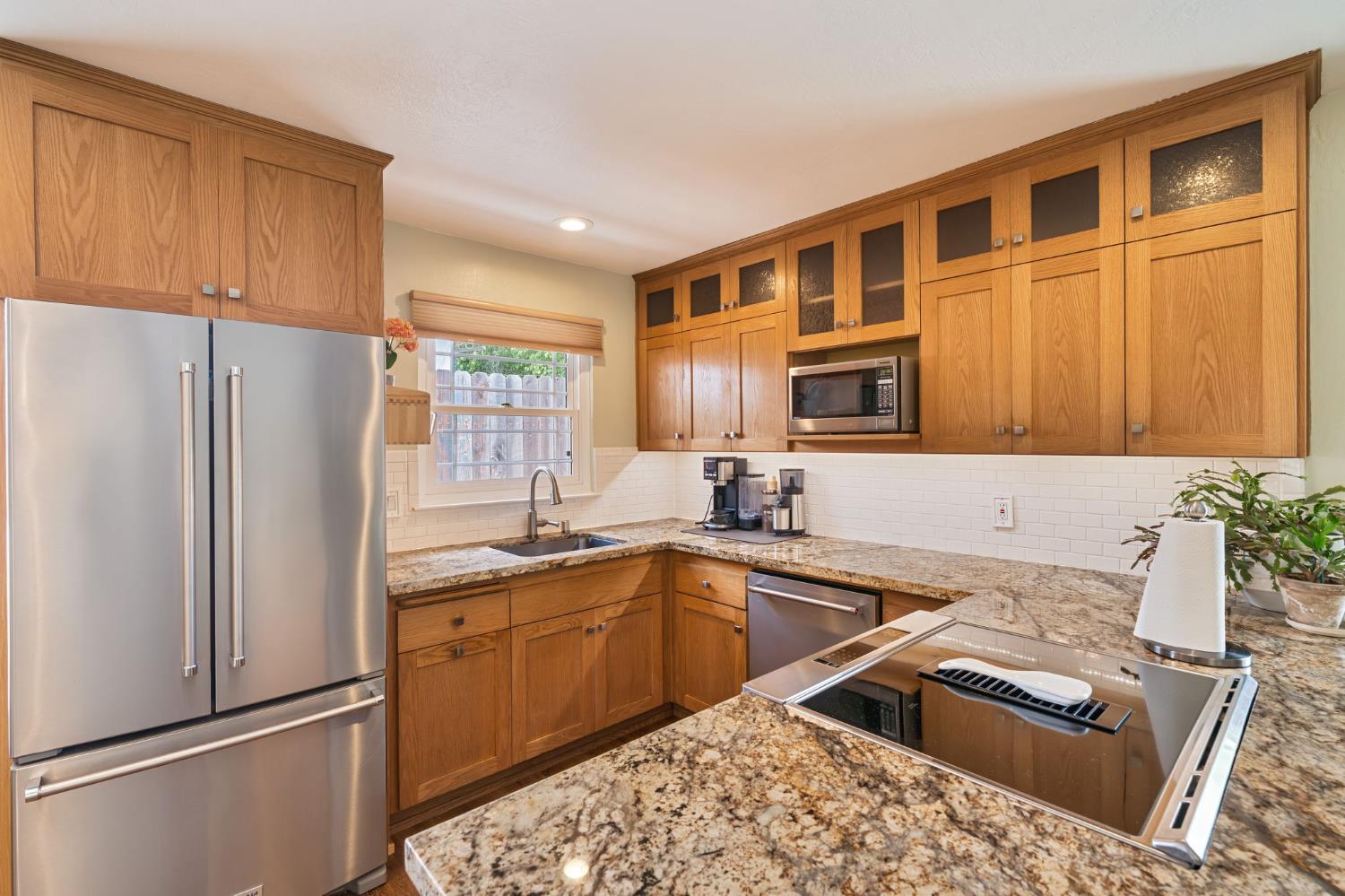 5422 Earnell Street Carmichael, CA 95608 - Photo 15 of 39 a kitchen with granite countertop a sink stove and refrigerator
