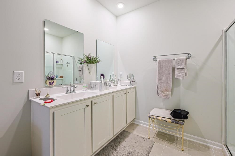 2115 Ridgedale Drive Conway, SC 29526 - Photo 13 of 38 Bathroom featuring a shower stall, double vanity, and light tile patterned floors