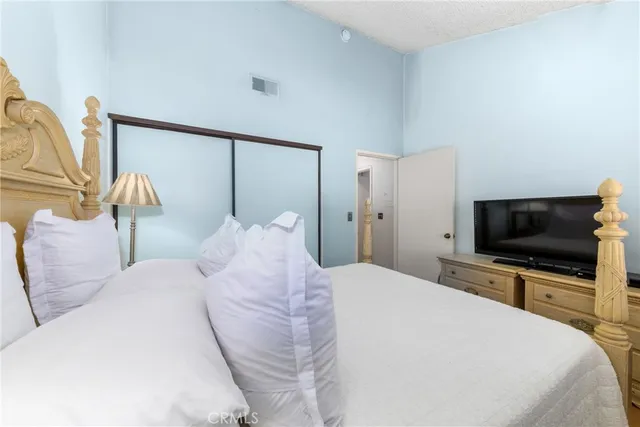 a bed room with a bed and a window