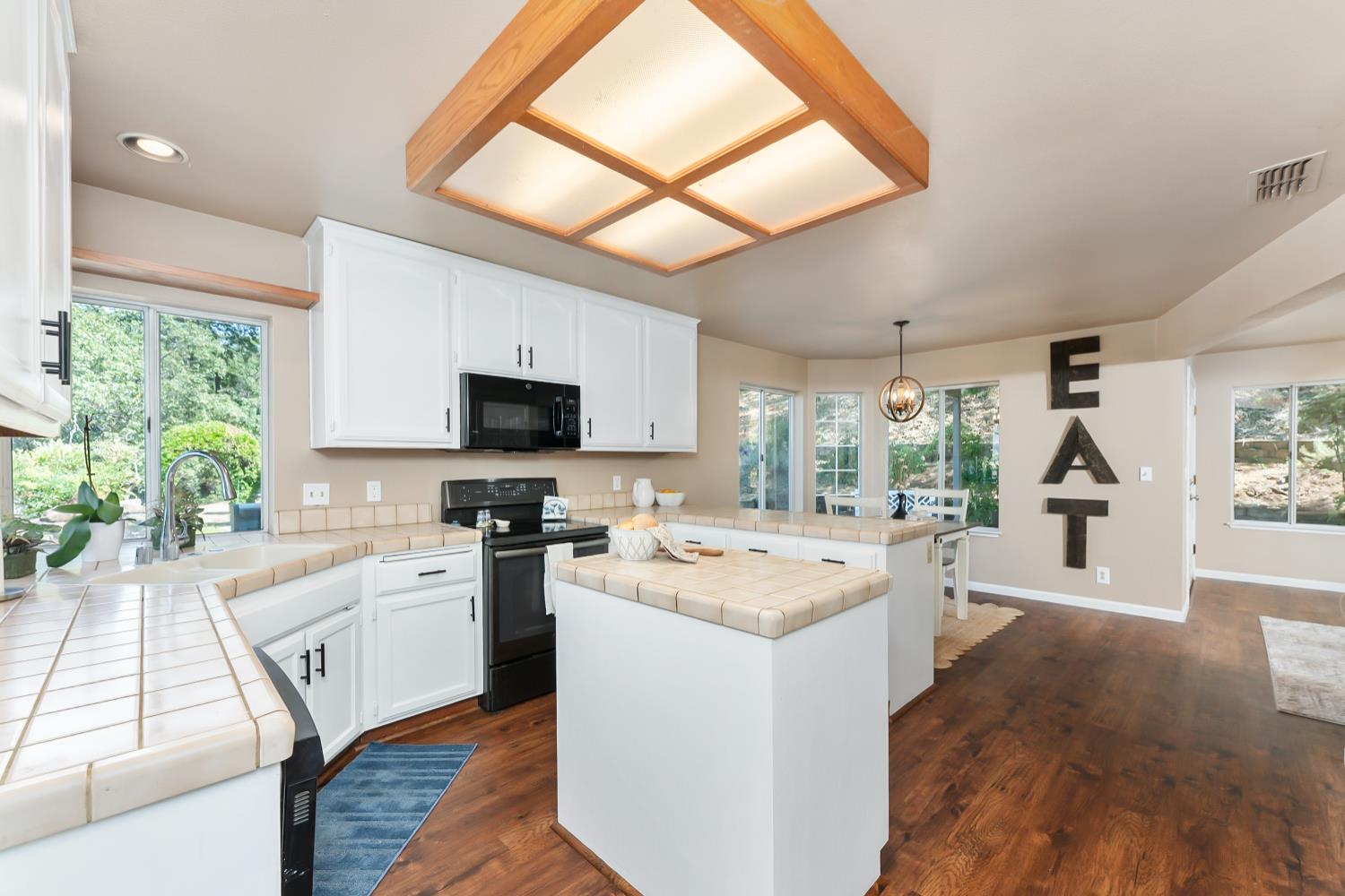 3472 See View Court Rescue, CA 95672 - Photo 14 of 56 a open kitchen with sink a microwave and stove