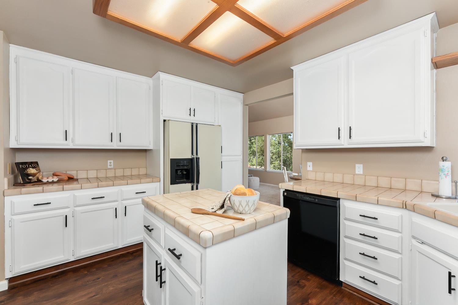 3472 See View Court Rescue, CA 95672 - Photo 16 of 56 a kitchen with a sink stove and white cabinets