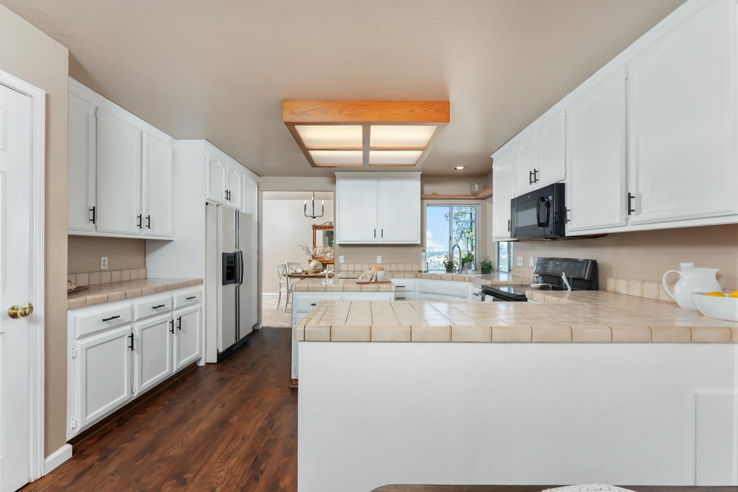 3472 See View Court Rescue, CA 95672 - Photo 17 of 56 a kitchen with stainless steel appliances white cabinets a sink a stove a refrigerator and white cabinets