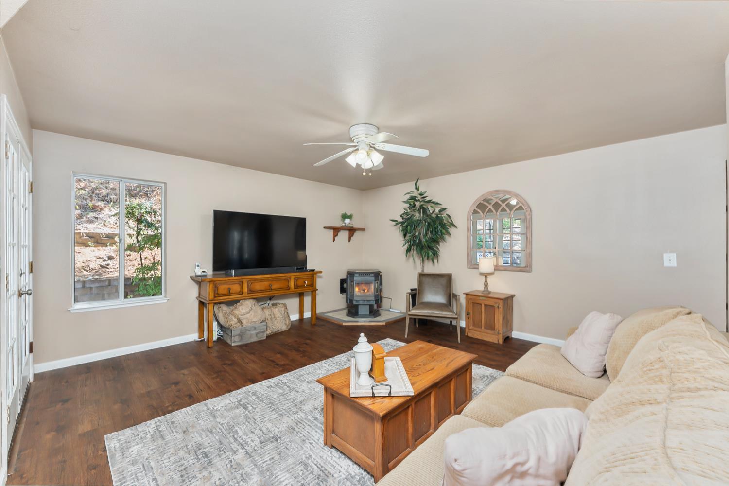 3472 See View Court Rescue, CA 95672 - Photo 23 of 56 a living room with furniture a flat screen tv and a large window