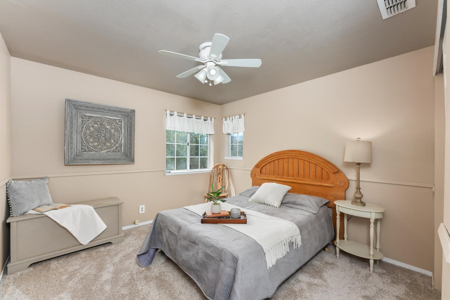3472 See View Court Rescue, CA 95672 - Photo 25 of 56 a bedroom with a bed and a chandelier