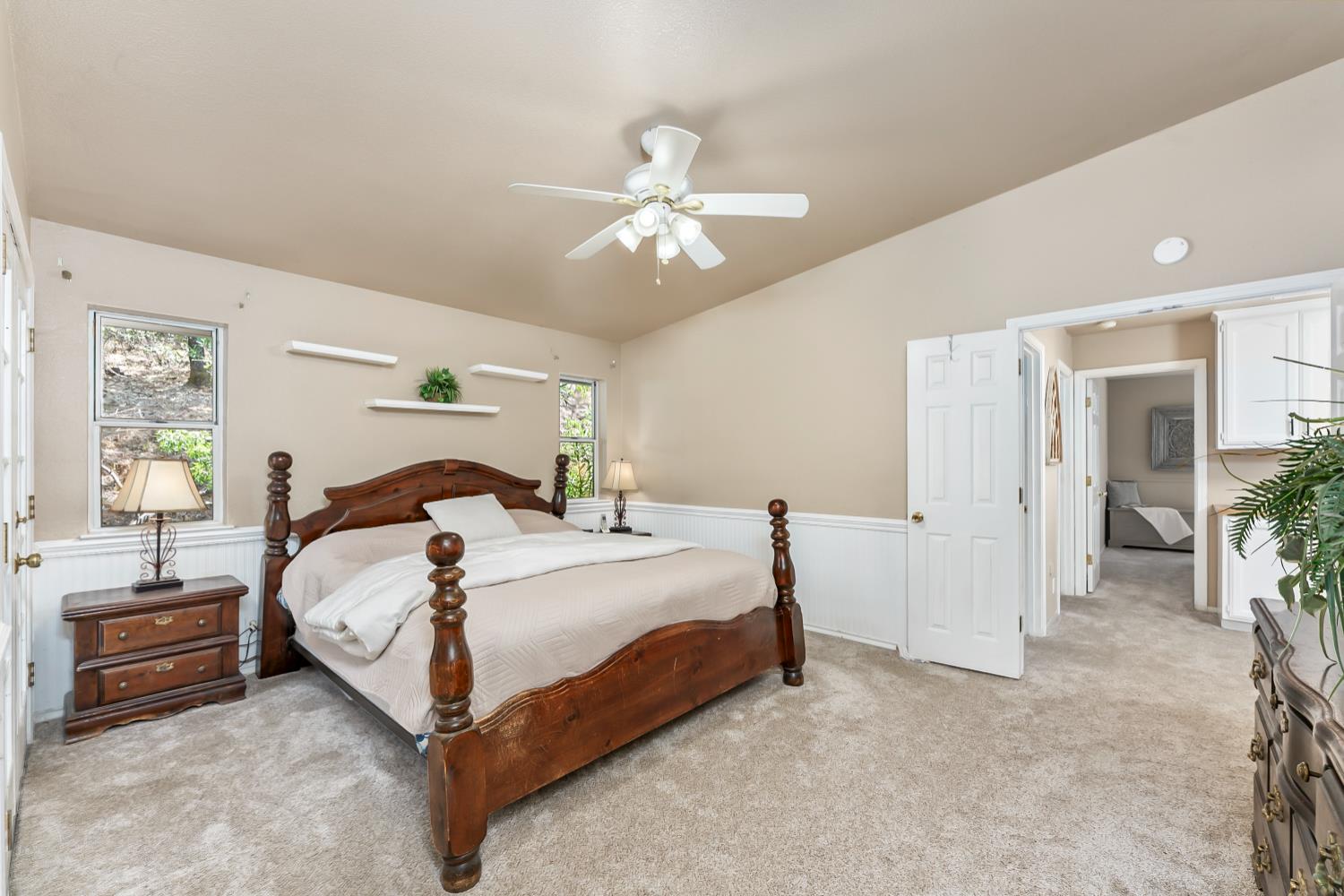 3472 See View Court Rescue, CA 95672 - Photo 32 of 56 a bedroom with a bed and a chandelier