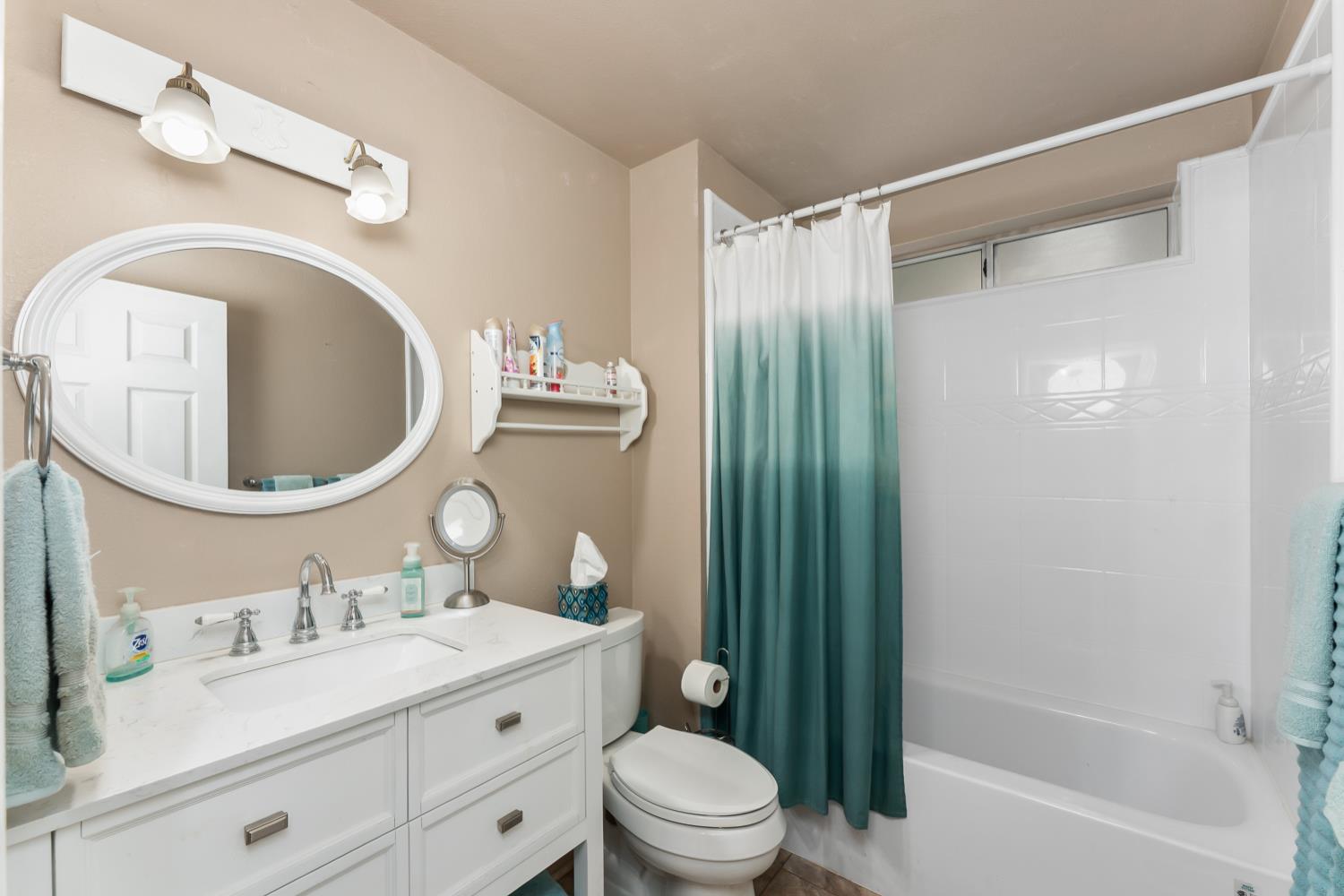 3472 See View Court Rescue, CA 95672 - Photo 36 of 56 a bathroom with a toilet a sink and a mirror