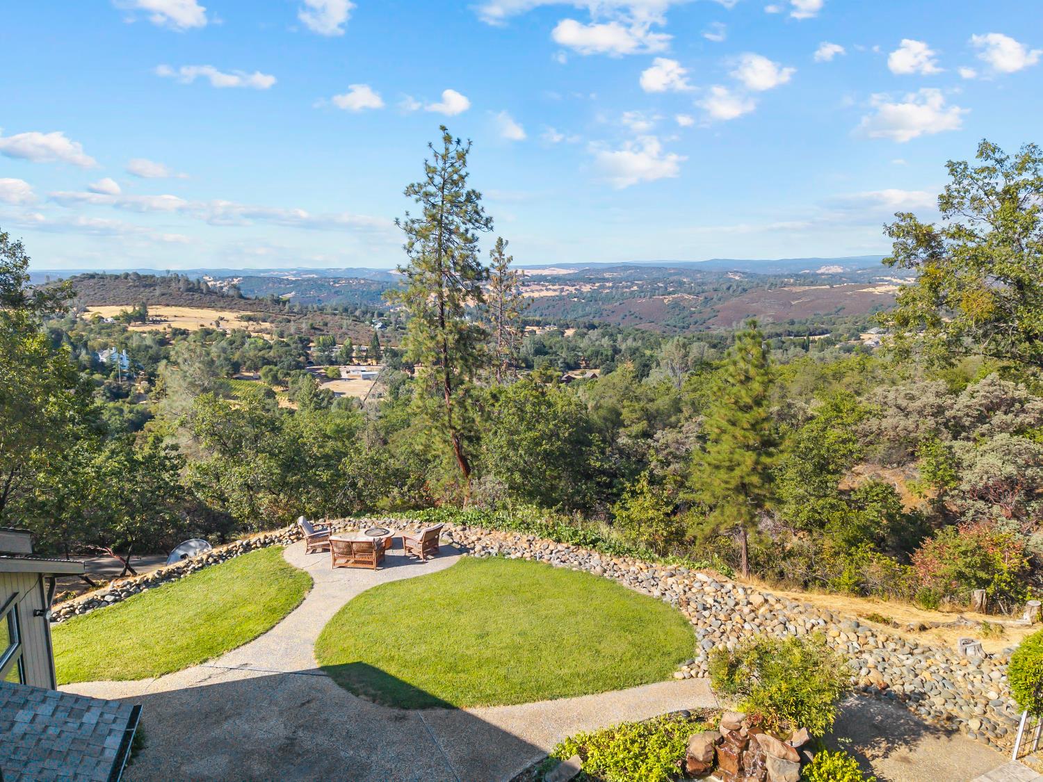 3472 See View Court Rescue, CA 95672 - Photo 49 of 56 a view of a swimming pool with a yard and large trees