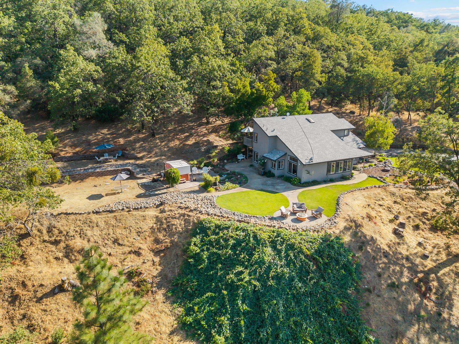 3472 See View Court Rescue, CA 95672 - Photo 50 of 56 an aerial view of a house with swimming pool and large trees