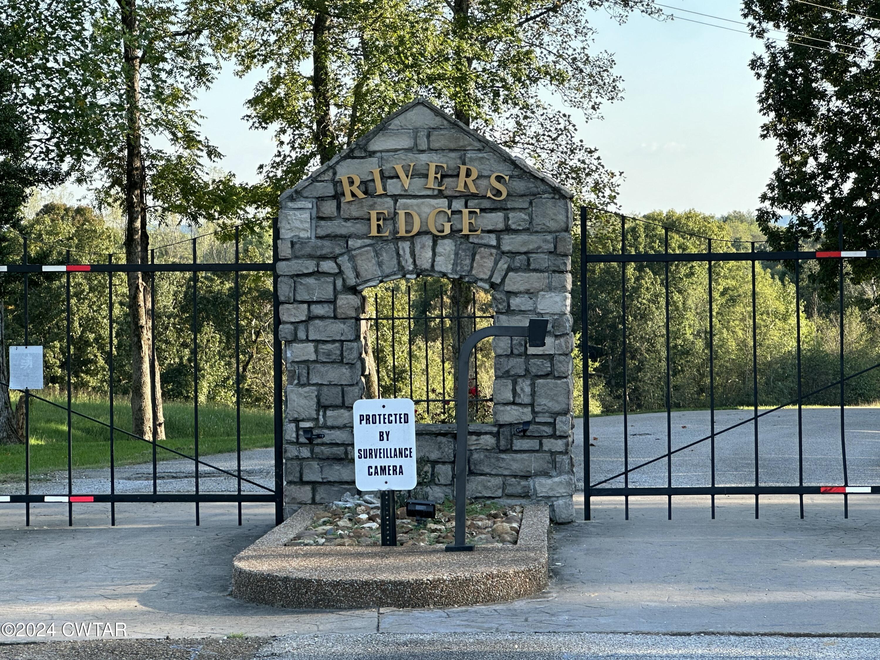 0 Lot 11 Rivers Edge Circle Bath Springs, TN 38311 - Photo 10 of 10 a view of a brick building next to a yard