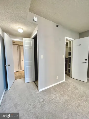 a room with cabinets and a fireplace
