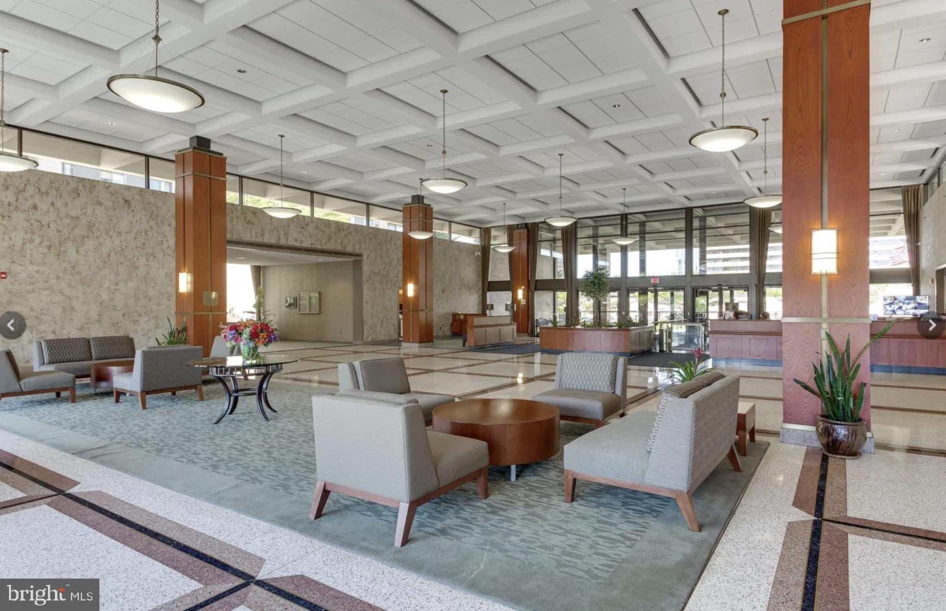 5501 Seminary Road, Unit 913S Falls Church, VA 22041 - Photo 25 of 28 a living room with lots of furniture and a chandelier