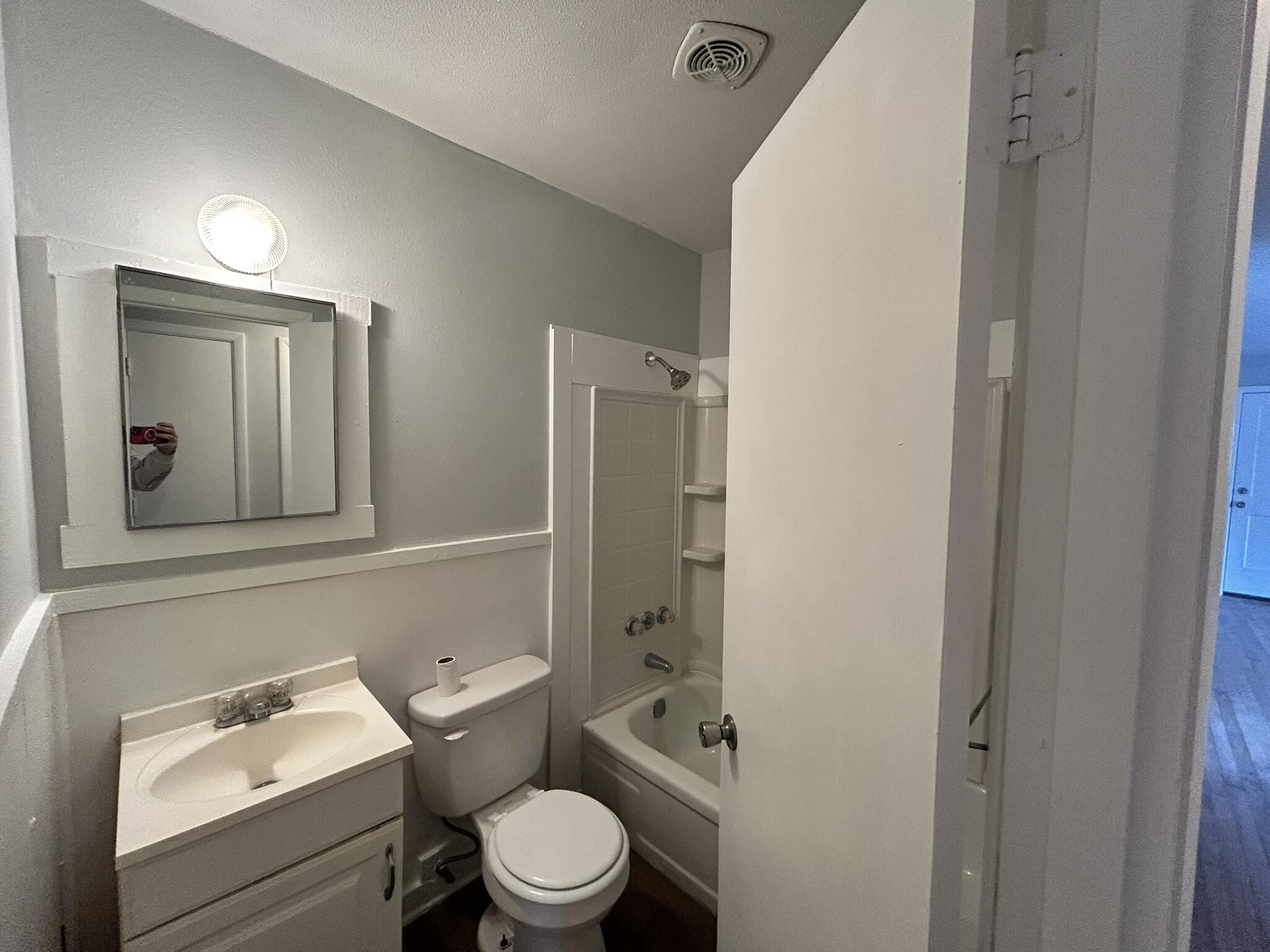 553 Purl Adams Avenue Crestview, FL 32539 - Photo 11 of 13 a white toilet sitting next to a bathroom sink