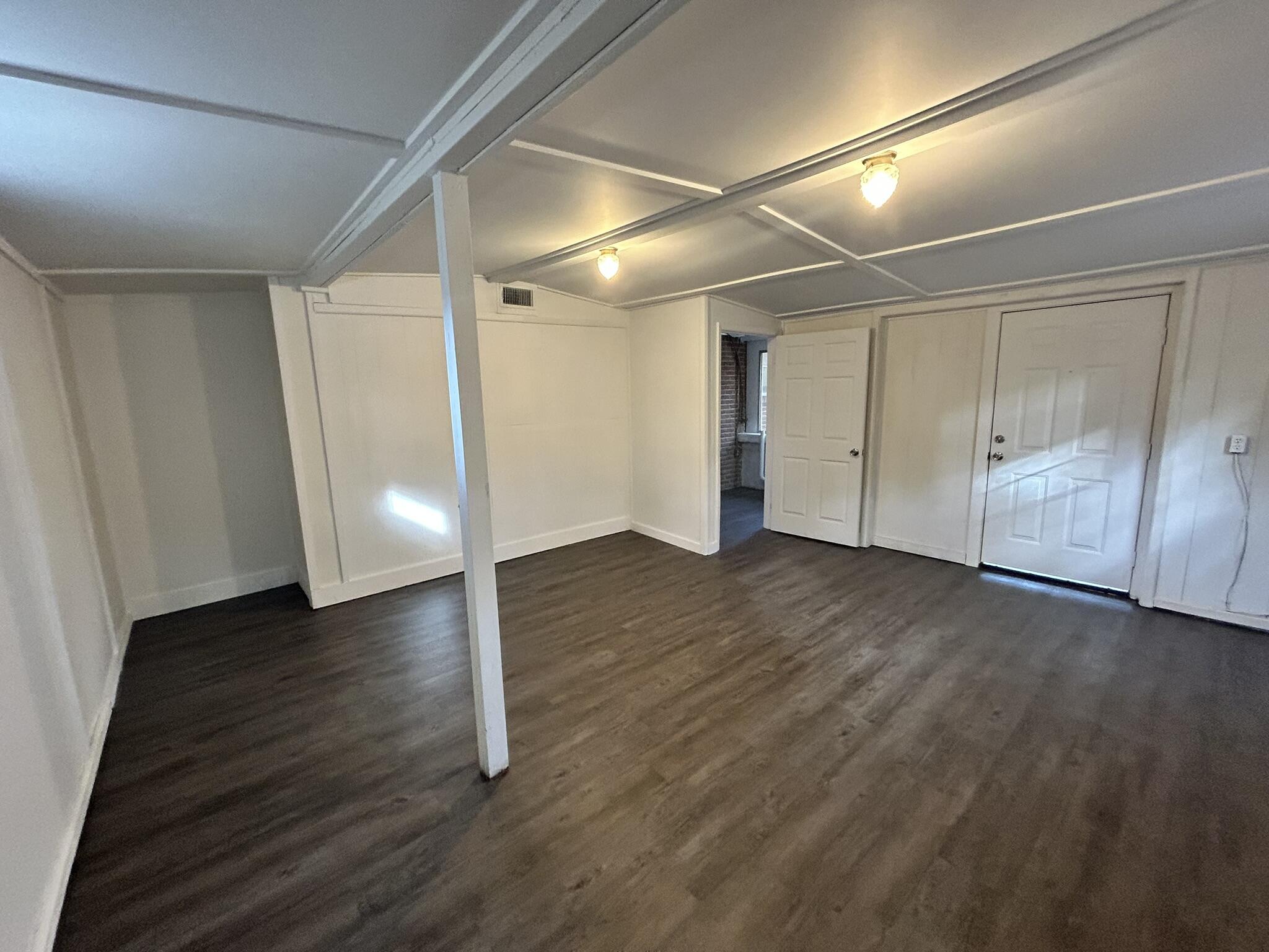 553 Purl Adams Avenue Crestview, FL 32539 - Photo 8 of 13 a view of empty room with wooden floor
