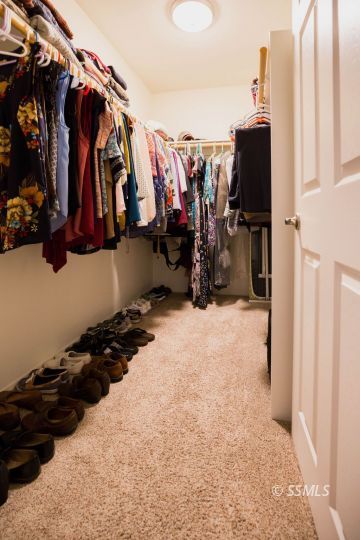 1609 South McCall Street Ridgecrest, CA 93555 - Photo 23 of 33 a view of walk in closet with clothes and shoes