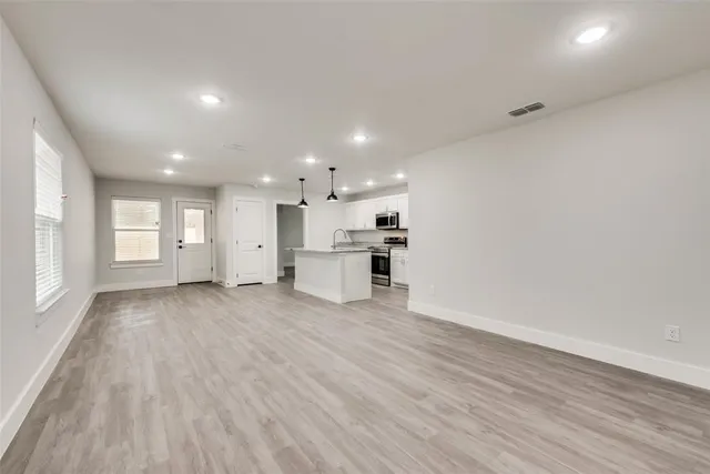 a view of an empty room with a window