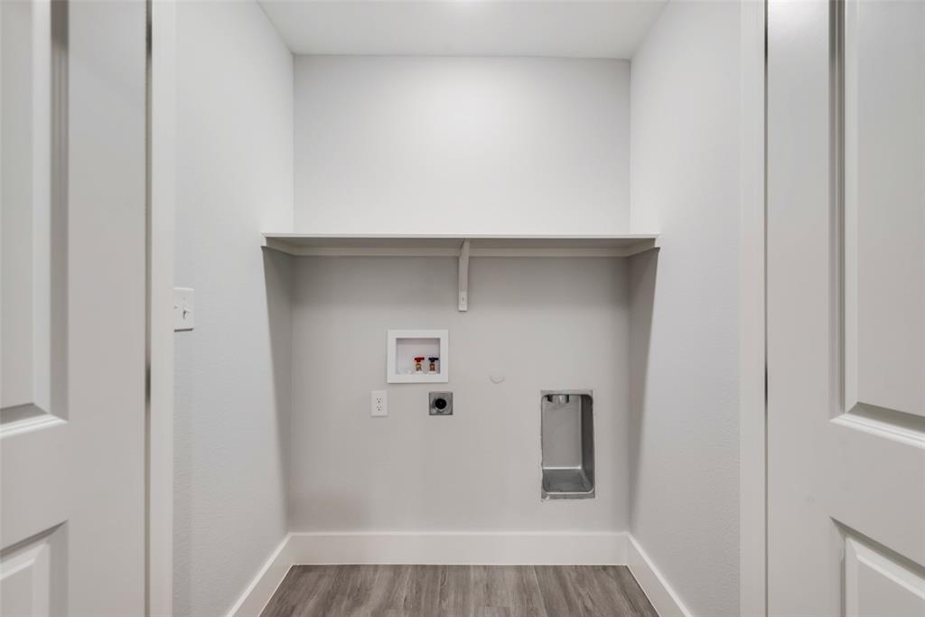 420 East 5th Street Bonham, TX 75418 - Photo 16 of 16 a view of a hallway with wooden floor and closet