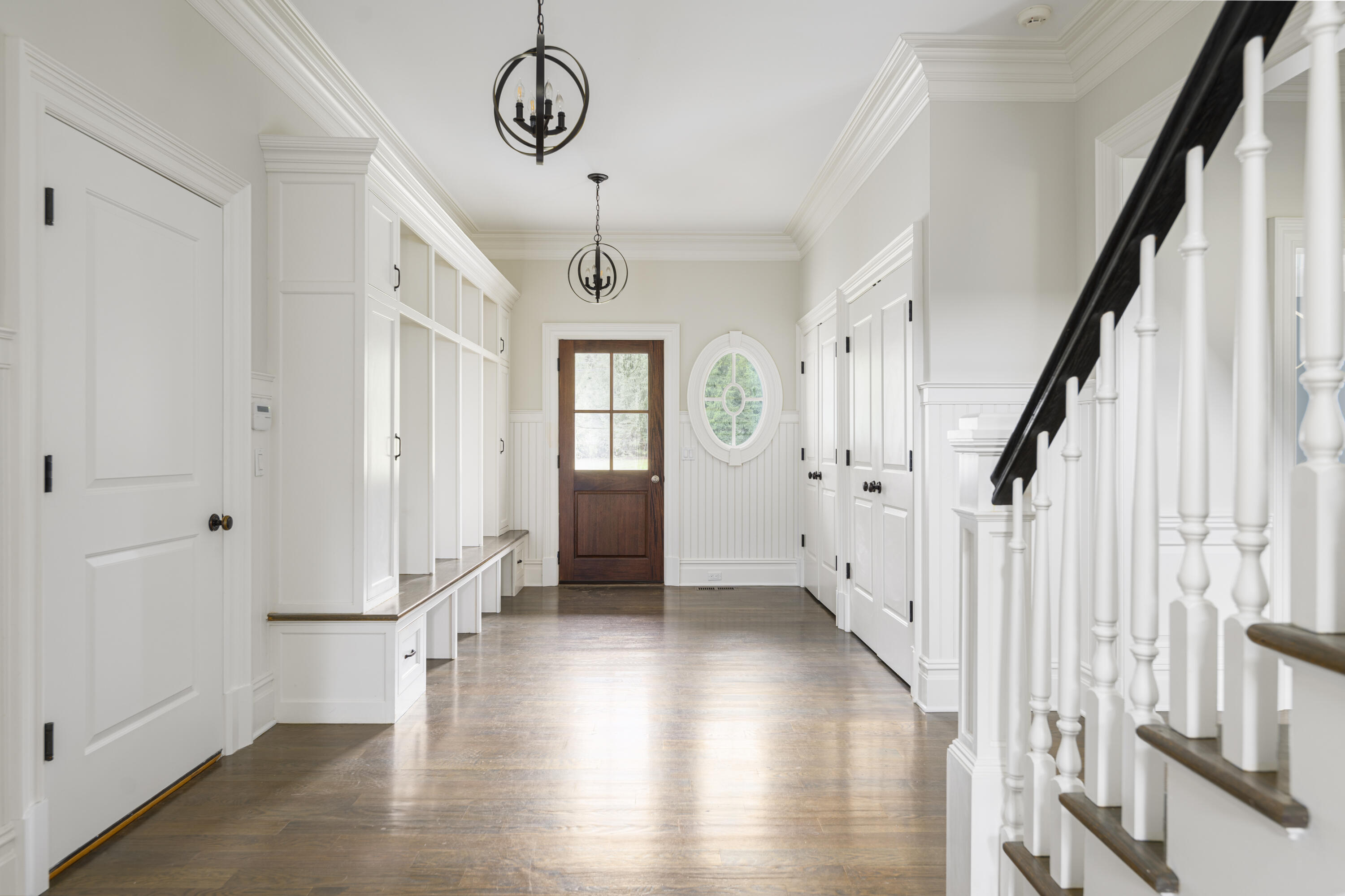 375 West Road New Canaan, CT 06840 - Photo 14 of 26 a view of an entryway with wooden floor and stairs