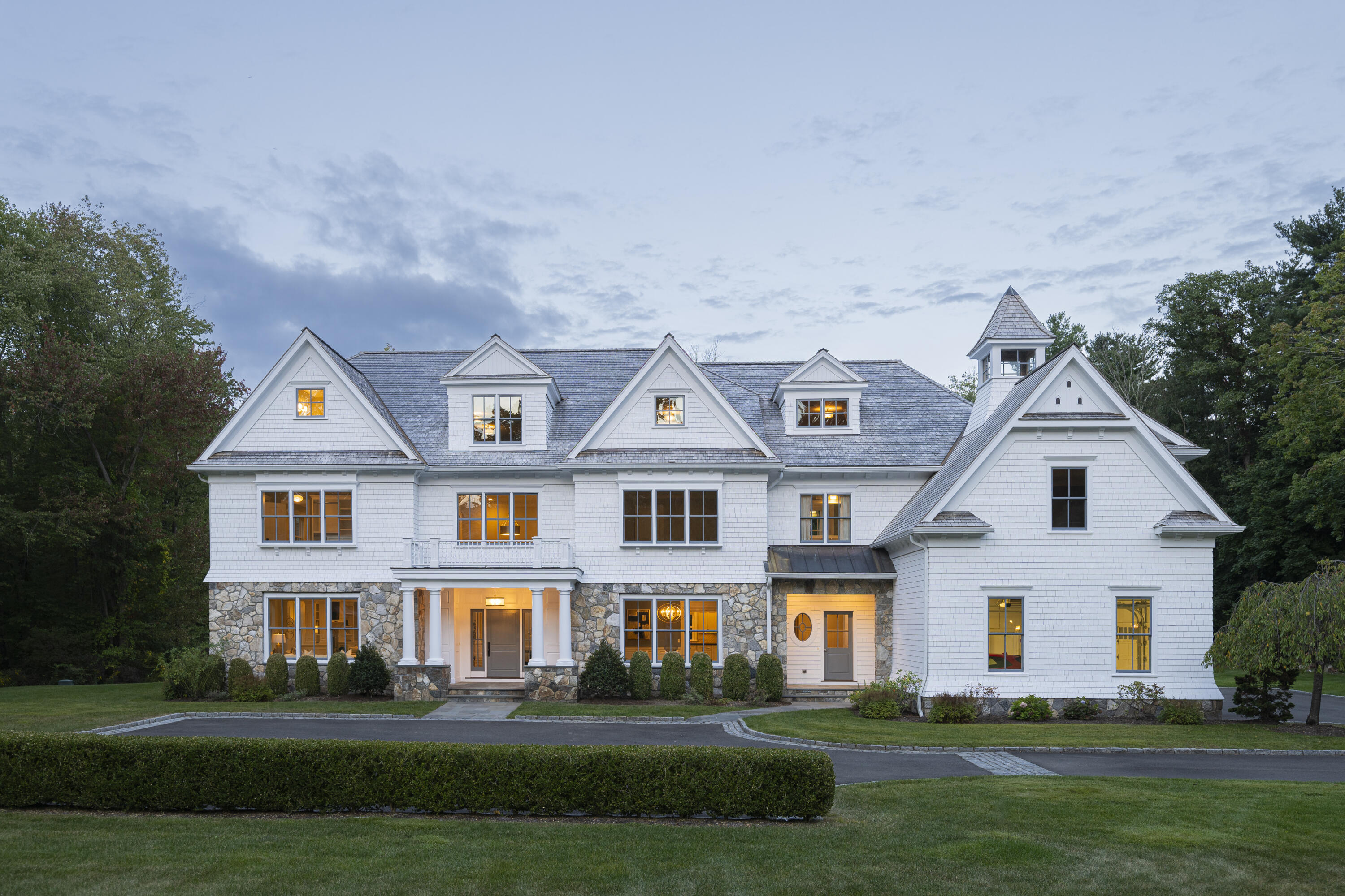 375 West Road New Canaan, CT 06840 - Photo 26 of 26 a front view of a house with a garden and trees