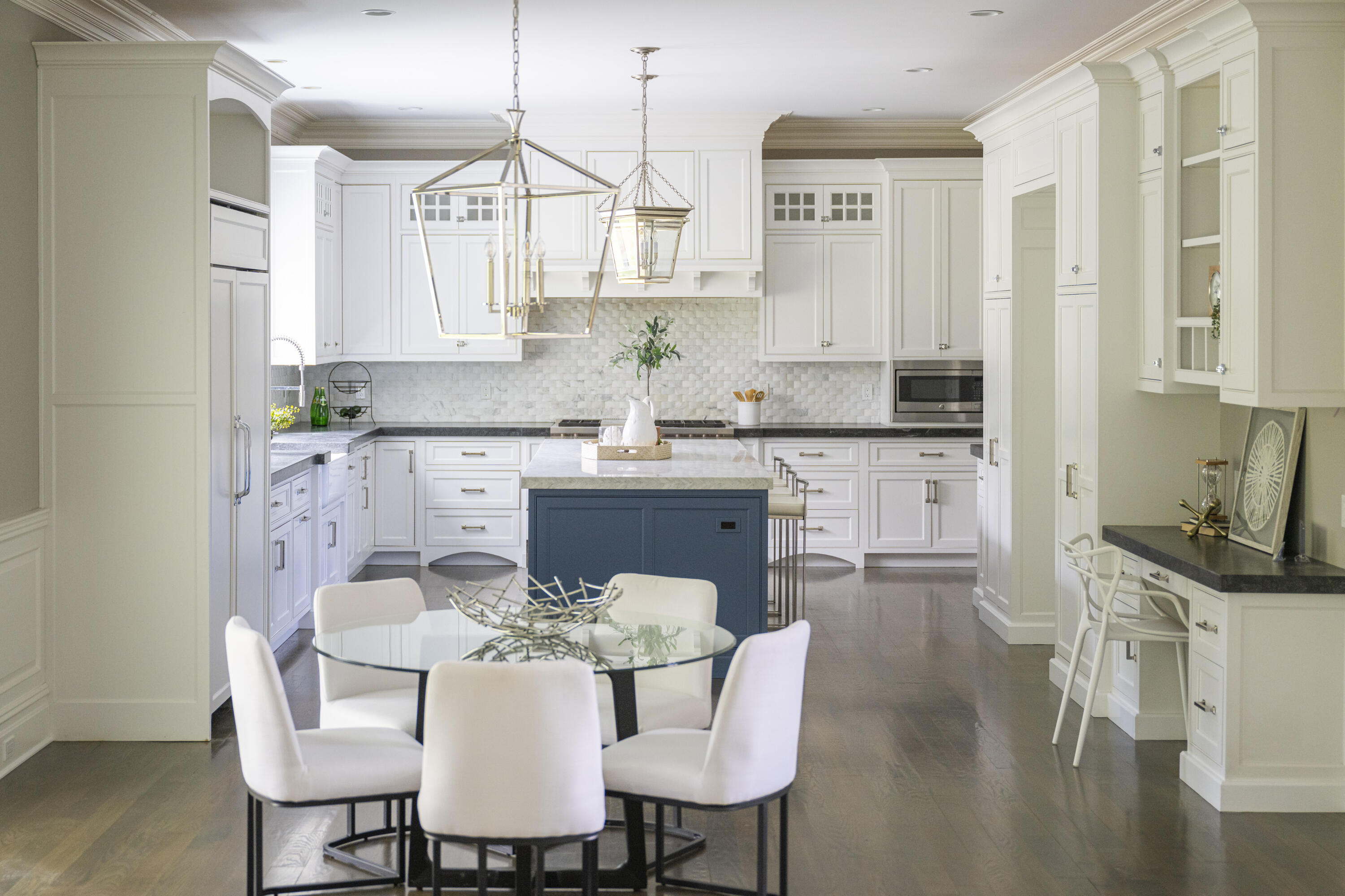 375 West Road New Canaan, CT 06840 - Photo 9 of 26 a kitchen with stainless steel appliances granite countertop a sink a stove a dining table and chairs