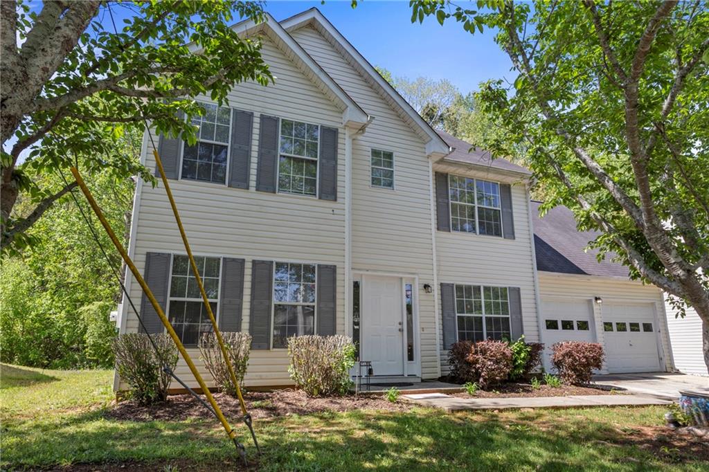 4832 Hidden Creek Place Decatur, GA 30035 - Photo 1 of 1 a front view of a house with garden