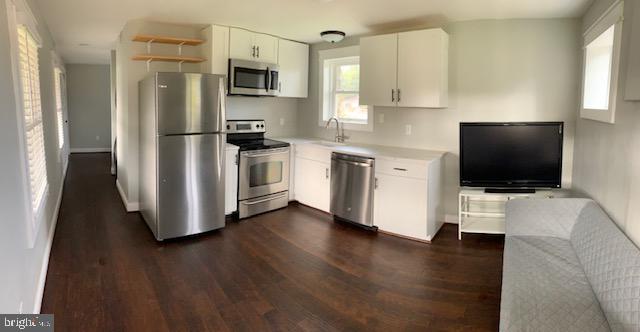 18812 Harmony Church Road Leesburg, VA 20175 - Photo 3 of 6 a kitchen with stainless steel appliances a refrigerator stove and microwave