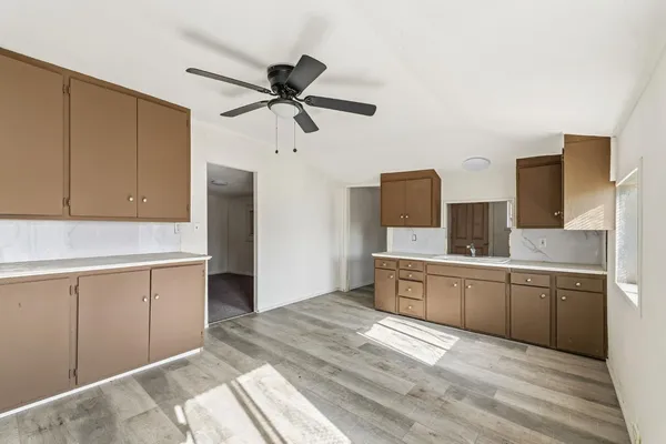 a kitchen with stainless steel appliances granite countertop a sink and cabinets