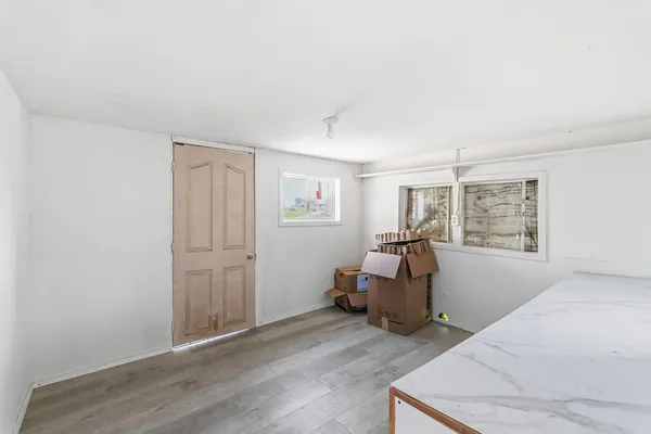 a kitchen with a refrigerator and a sink