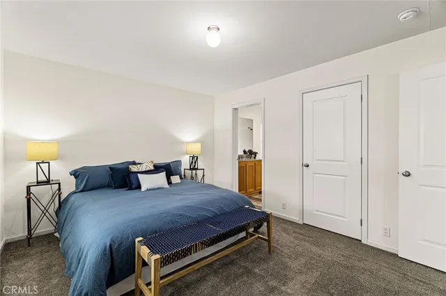 a bedroom with furniture and window