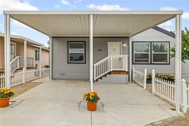 an outdoor view of porch with a chair