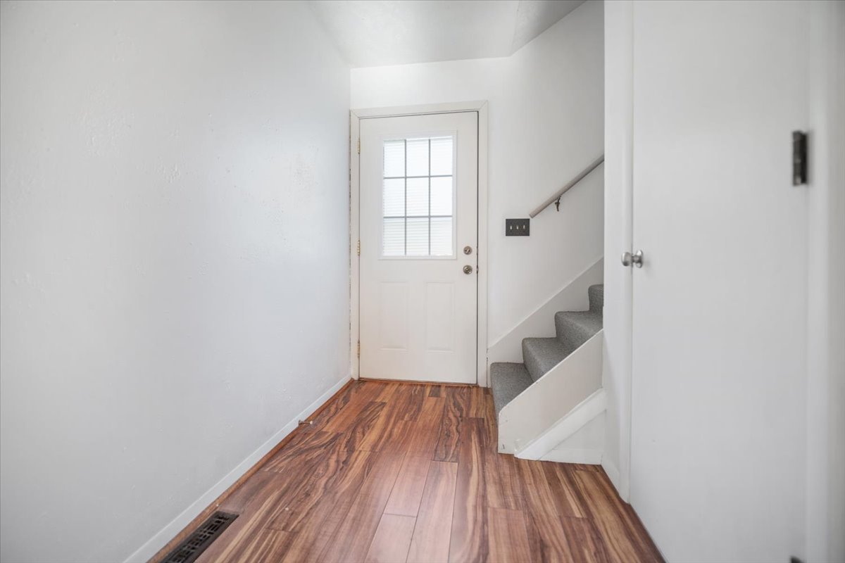 1707 King Drive, Unit D Normal, IL 61761 - Photo 11 of 24 an empty room with wooden floor and entryway
