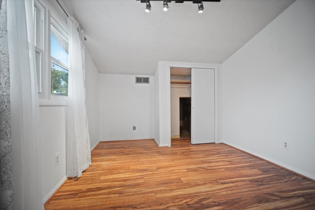 1707 King Drive, Unit D Normal, IL 61761 - Photo 14 of 24 a bedroom with a bed and a window